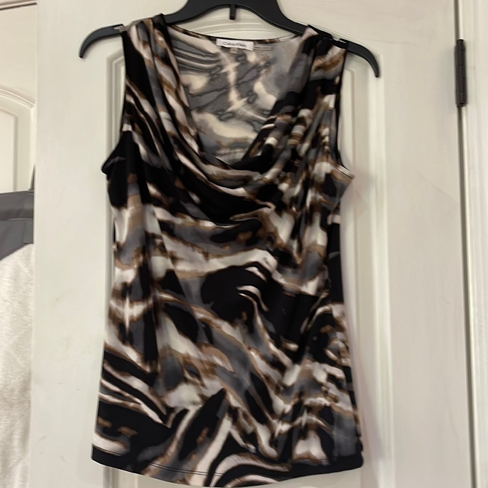 Calvin Klein top with pretty neckline. Excellent condition. Size small.